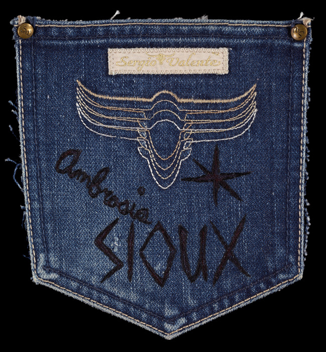 Allison Manch, AMBROSIA SIOUX, 2011, ink and embroidery on blue jean pocket, 6.5 x 6 inches.